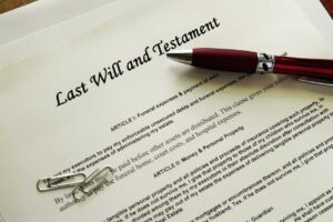 Last Will and Testament with pen and paper clips on the Arch Angel Law Group blog Do I need a Will